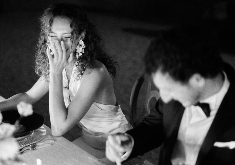 Couple sharing a fun moment during their intimate elopement dinner in Provence, South of France