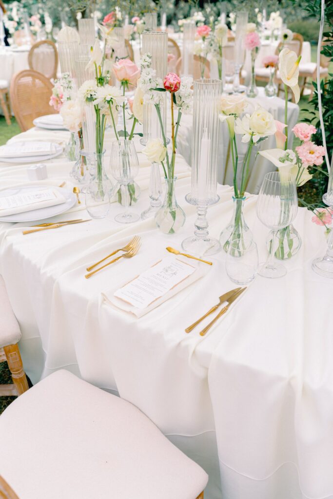 Luxury wedding dinner at Chateau d'Estoublon, long tables under crystal chandeliers