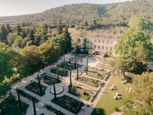Chateau d'Estoublon wedding ceremony in Provence, the main courtyard for a dinner set up