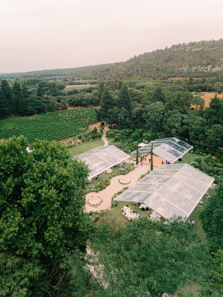 Chateau d'Estoublon garden cocktail hour, Provence wedding celebration.