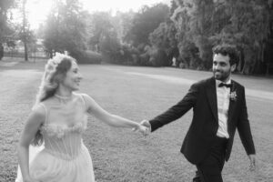 Elegant couple after their ceremony in a sunny day, with floral décor and a luxury destination wedding setup in Lake Como, 2026.