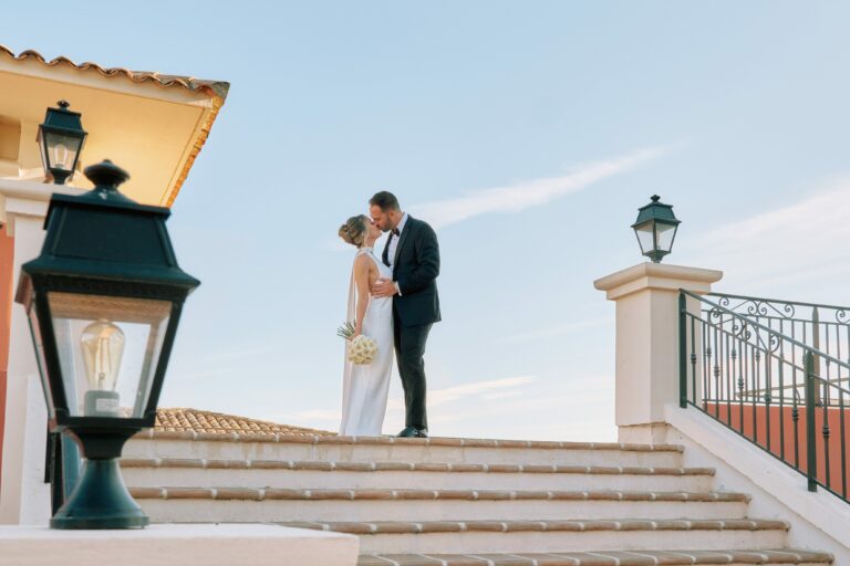 Krista and Mark sharing a sunlit kiss at Château de Crémat, French Riviera elopement