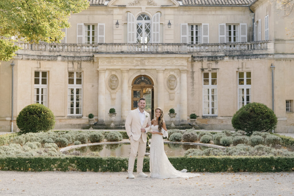 Couple sitting together reading an elopement announcement message on a phone