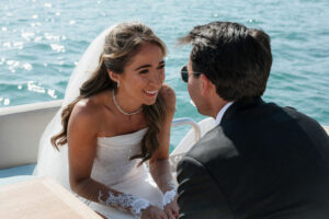 Boat photoshoot of Sarah and Zach traveling from their Cannes hotel to their Antibes wedding venue on the French Riviera